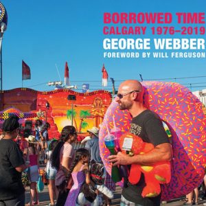 Borrowed time by george webber. A man holding a inflatable inner tube shaped like a doughnut