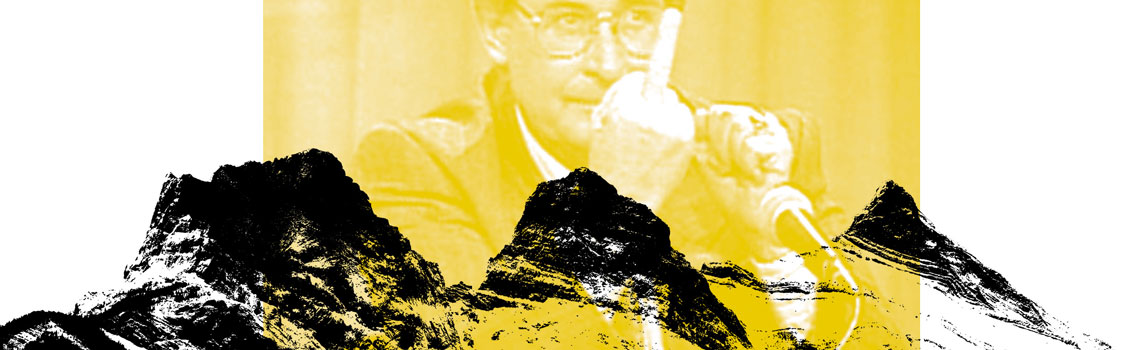 Ralph Klein giving the finger to the reader from behind the three sister mountains in canmore