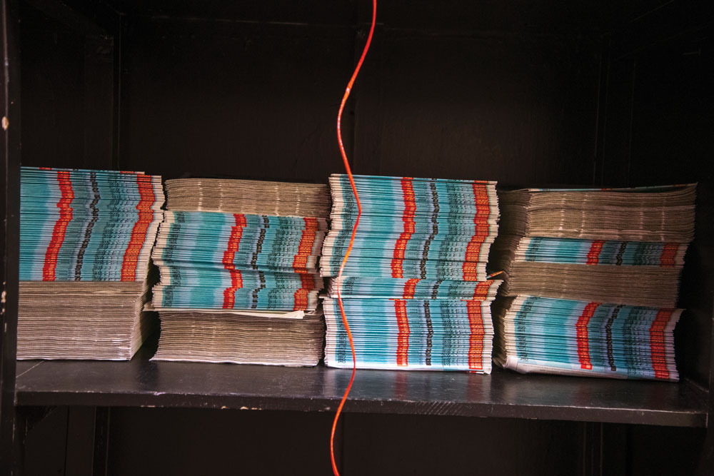 Newspapers being prepared for distribution (Photography by Guillaume Nolet)
